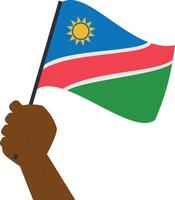 hand innehav och höjning de nationell flagga av namibia vektor