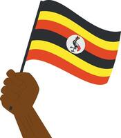 Hand halten und erziehen das National Flagge von Uganda vektor