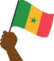 Hand halten und erziehen das National Flagge von Senegal vektor