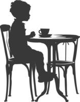 Silhouette wenig Junge Sitzung beim ein Tabelle im das Cafe schwarz Farbe nur vektor