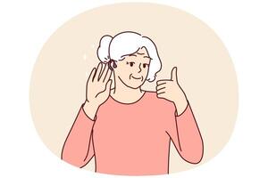 äldre kvinna användningar hörsel hjälpa och visar tummen upp bekräftande Bra ljud volym tack till ny enhet vektor