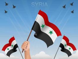 syrische fahnen wehen unter blauem himmel vektor