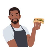 jung Koch Mann halten ein Sandwich. Mann Herstellung Sandwich. vektor