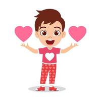 glücklicher süßer Kinderjungencharakter, der Händchen hält und zusammenhält und mit Herzformsymbol winkt vektor