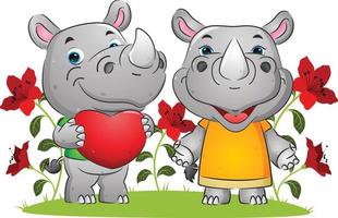 das Paar glücklicher Nashörner, die am Valentinstag im Garten Liebe ausdrücken vektor