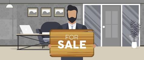 Ein Geschäftsmann hält ein Holzschild mit der Aufschrift zum Verkauf. junger Mann im Anzug mit einem Holzschild. das Konzept des Verkaufs einer Wohnung, eines Büros oder eines Gebäudes. vektor