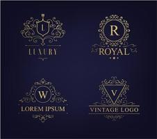 vektor lyx logotyp set med heraldiska vapen och blomstrar kalligrafiska