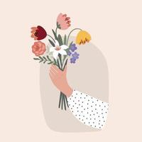 Frauenhand hält einen Frühlingsblumenstrauß für den internationalen Frauentag.