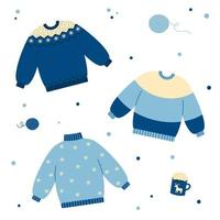 Set warmer Pullover in blauen Farben. Winter- oder Herbstkleidung. Doodle-Stil. Weihnachtsferien Stimmung. vektor