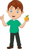 kleiner junge der karikatur, der eine orange frucht hält und daumen aufgibt
