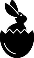 Kaninchen im Osterei-Glyphen-Symbolvektor vektor