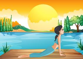 En tjej som utför yoga längs floden vektor