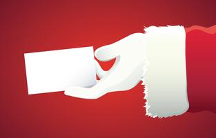 Weihnachtsmann-Hand, die Ihren Weihnachtstext oder -produkt über rotem Hintergrund mit Kopienraum darstellt