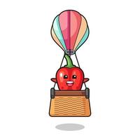 Maskottchen aus roter Paprika, das einen Heißluftballon reitet vektor