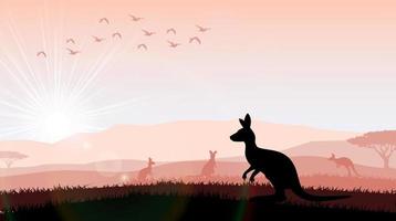 Silhouette ein Känguru bei der Fütterung im hellen Sonnenuntergang vektor