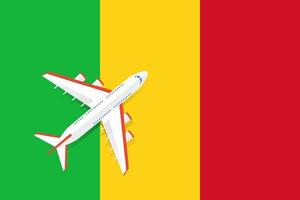 vektorillustration eines passagierflugzeugs, das über die flagge von mali fliegt. Konzept von Tourismus und Reisen vektor