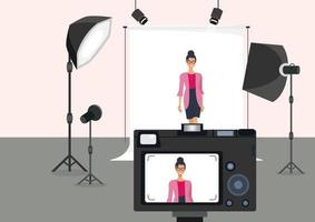 schönes Modell im Modefotostudio mit Sucher hinter der Kamera. Bild auf weißem Hintergrund mit hellen Lichtern, Cartoon-Illustration, flacher Stil, Vektor