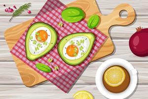 ovanifrån mat krämig avokado ägg baka med bordstablett på trä tallrik på trä bord vektor