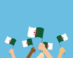 Vector Illustration von den Händen, die Algerien-Flaggen halten, die auf blauem Hintergrund lokalisiert werden