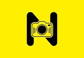 svart gul av initial n bokstav med kamera vektor
