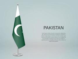 pakistan hängande flagga på stativ. mall för konferens banner vektor