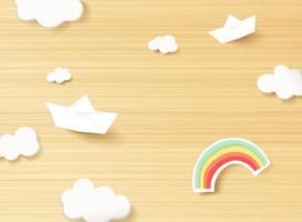 süße kinder- oder babykarte, weiße wolken und papier geschnittener regenbogen auf dem hölzernen hintergrund vektor