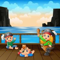 Cartoon-Baby-Piraten auf einem Deck vektor