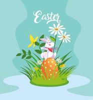süßes Kaninchen mit Ei von Ostern im Garten vektor