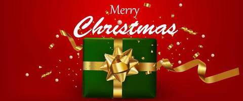 frohe weihnachten text mit grüner geschenkbox und goldband zum feiern vektor