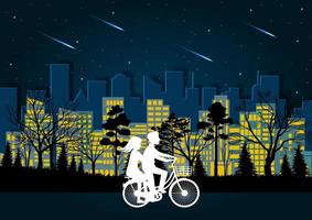Män och kvinnor cyklar på vägen på natten vektor
