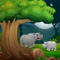 nattskog med en noshörningsmamma och hennes unge under trädet vektor
