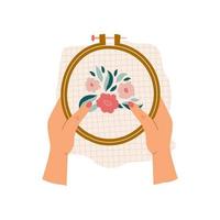 kvinnliga händer som håller broderibåge med blommiga broderier isolerad på vit bakgrund. moderna färgglada vektor handritad illustration