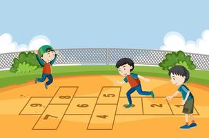 barn som spelar hopscotch spel i parken vektor