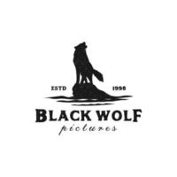 Stehender schwarzer Wolf, Fuchs, Hund, Kojote, Schakal auf dem Felsen, rustikale Vintage-Silhouette, Retro-Hipster-Logo-Design vektor
