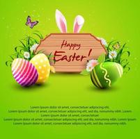 Ostergrußkarte mit Holzschild, Hasenohren, Eiern und Gras auf grünem Hintergrund