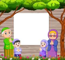 mormor och farfar med deras barnbarn hälsar ied mubarak nära den tomma tavlan vektor
