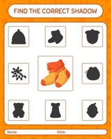 Finden Sie das richtige Schattenspiel mit Socke. arbeitsblatt für vorschulkinder, kinderaktivitätsblatt vektor