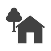 hus med träd glyf svart ikon vektor