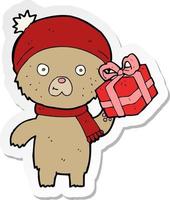 Aufkleber eines Cartoon-Weihnachts-Teddybären mit Geschenk vektor