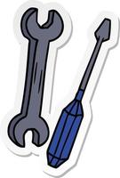 Aufkleber-Cartoon-Doodle eines Schraubenschlüssels und eines Schraubendrehers vektor