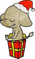 strukturierter Cartoon eines lächelnden Elefanten mit Weihnachtsmütze vektor