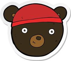 klistermärke av en tecknad svart björn ansikte vektor