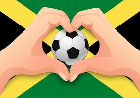 Jamaika-Fußball und Handherzform vektor