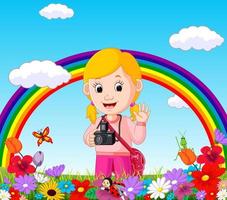 söt flicka i en blomsterträdgård med regnbåge vektor