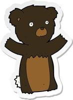 klistermärke av en tecknad svart björnunge vektor