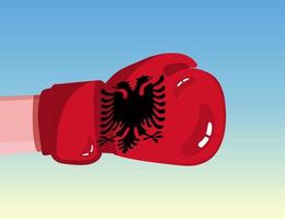 Flagge Albaniens auf Boxhandschuh. Konfrontation zwischen Ländern mit Wettbewerbsmacht. beleidigende Haltung. Gewaltenteilung. vorlagenfertiges Design. vektor