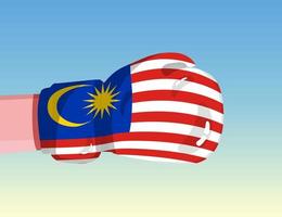 Flagge von Malaysia auf Boxhandschuh. Konfrontation zwischen Ländern mit Wettbewerbsmacht. beleidigende Haltung. Gewaltenteilung. vorlagenfertiges Design. vektor