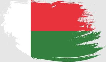 Madagaskar-Flagge mit Grunge-Textur vektor