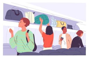 Passagiere legen ihr Handgepäck in den obersten Regalen des Flugzeugs ab