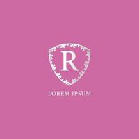 r-buchstabe-initial-logo-design-vorlage. luxus silber dekorative florale schildillustration. geeignet für Versicherungs-, Mode- und Schönheitsprodukte. isoliert auf rosa Hintergrund. vektor